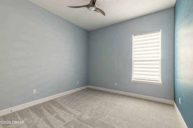 empty room featuring light carpet and ceiling fan