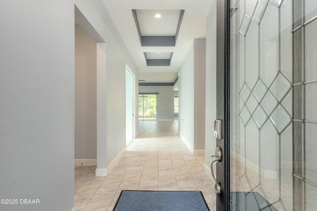 hallway with a tray ceiling