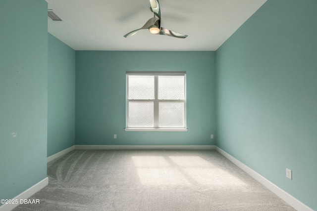 carpeted empty room with ceiling fan