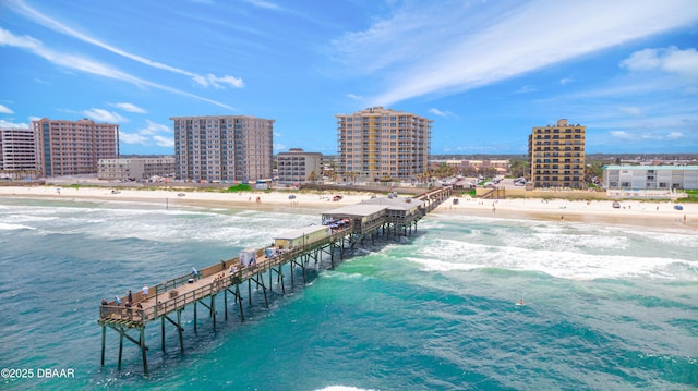 aerial view featuring a view of city, a water view, and a view of the beach