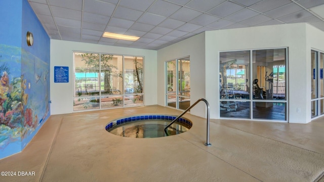 view of swimming pool featuring an indoor in ground hot tub