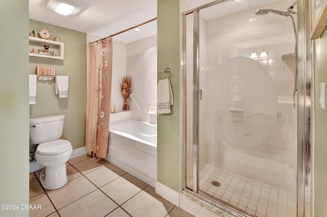 bathroom with tile patterned flooring, shower with separate bathtub, and toilet