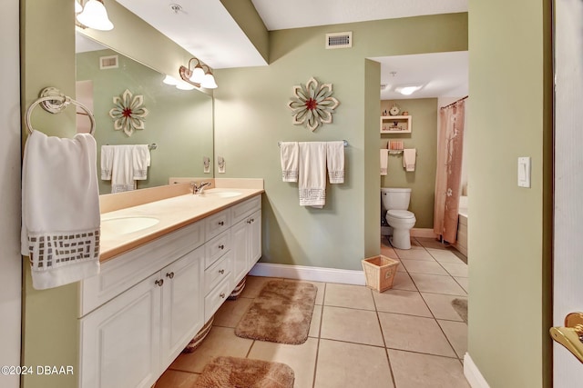 full bathroom featuring tile patterned flooring, vanity, toilet, and shower / tub combo