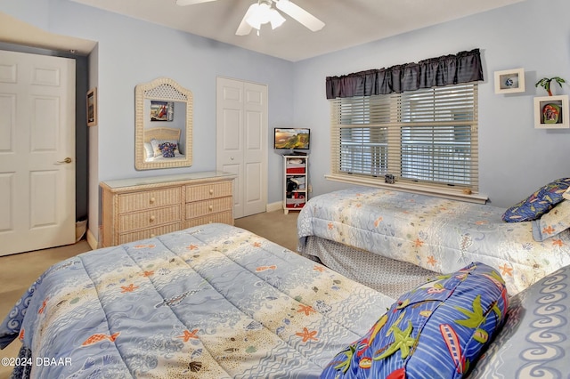 bedroom featuring ceiling fan, carpet flooring, and a closet