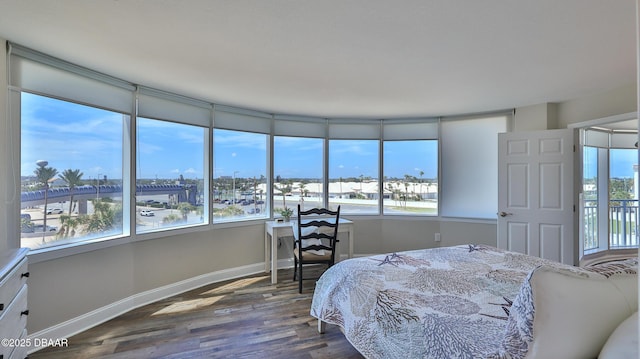 2625 S Atlantic Ave Unit 5Sw, Daytona Beach, FL 32118 - bedroom featuring dark wood-style floors and multiple windows