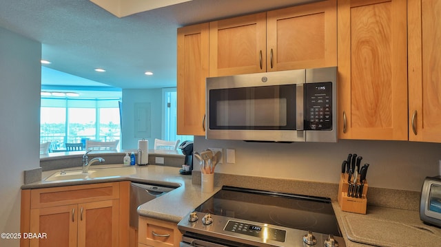 2625 S Atlantic Ave Unit 5Sw, Daytona Beach, FL 32118 - kitchen featuring stainless steel appliances, recessed lighting, light brown cabinets, and light countertops