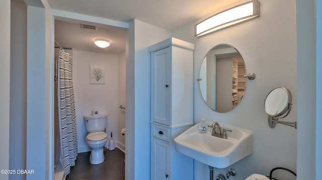 2625 S Atlantic Ave Unit 5Sw, Daytona Beach, FL 32118 - bathroom with toilet and curtained shower