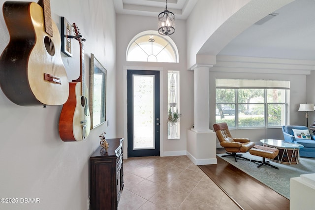 1214 Hampstead Ln, Ormond Beach, FL 32174 - entrance foyer with decorative columns, arched walkways, and light tile patterned floors