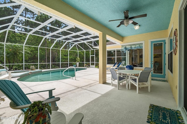 1214 Hampstead Ln, Ormond Beach, FL 32174 - view of swimming pool featuring a patio, ceiling fan, a pool with connected hot tub, and glass enclosure