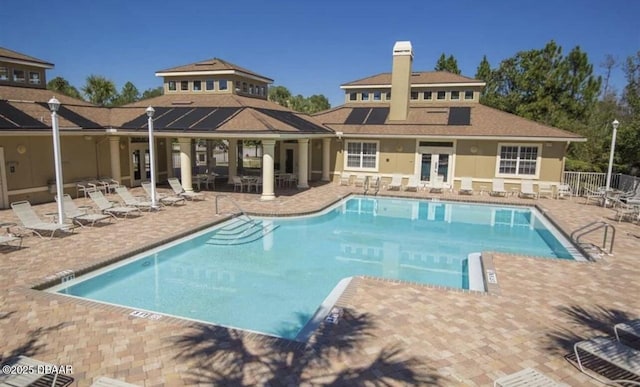 view of swimming pool with a patio