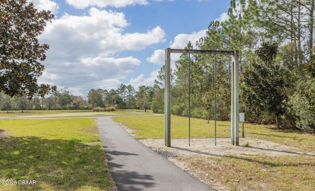 view of home's community with a yard