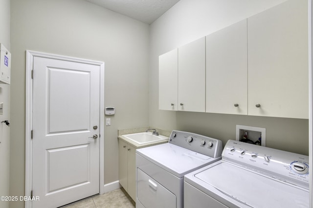 408 Chelsea Place Ave, Ormond Beach, FL 32174 - laundry area with a sink, light tile patterned floors, cabinet space, and washer and dryer