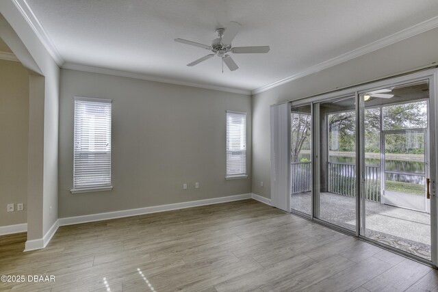 408 Chelsea Place Ave, Ormond Beach, FL 32174 - empty room featuring baseboards, ornamental molding, a ceiling fan, and wood finished floors