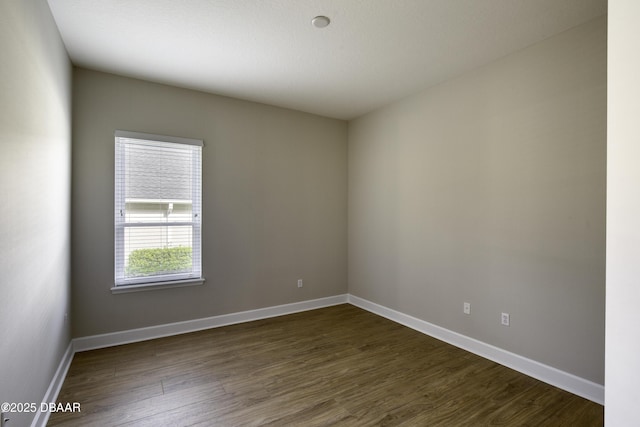 408 Chelsea Place Ave, Ormond Beach, FL 32174 - spare room with baseboards and dark wood-style floors
