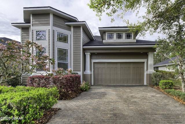 408 Chelsea Place Ave, Ormond Beach, FL 32174 - view of front of home featuring an attached garage and decorative driveway