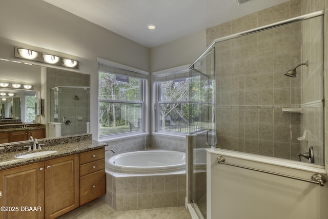 408 Chelsea Place Ave, Ormond Beach, FL 32174 - bathroom featuring a garden tub, tile patterned floors, vanity, and a shower stall