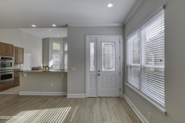 408 Chelsea Place Ave, Ormond Beach, FL 32174 - entrance foyer featuring light wood-style floors, recessed lighting, baseboards, and crown molding