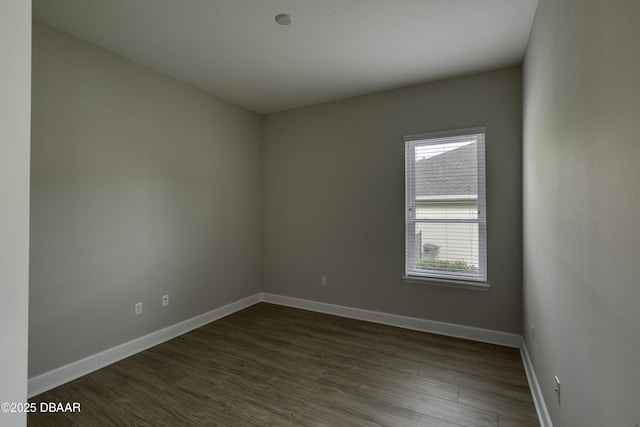 408 Chelsea Place Ave, Ormond Beach, FL 32174 - empty room with baseboards and dark wood-type flooring