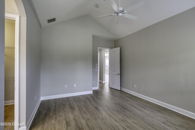 408 Chelsea Place Ave, Ormond Beach, FL 32174 - unfurnished bedroom featuring baseboards, dark wood-style flooring, lofted ceiling, and visible vents