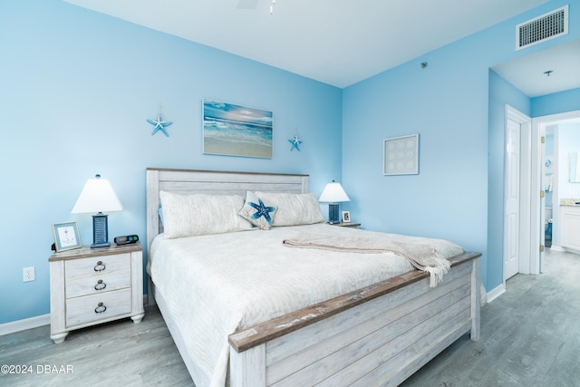 bedroom featuring wood-type flooring