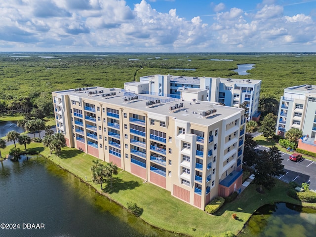 drone / aerial view with a water view