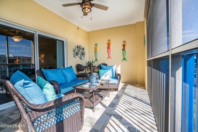 interior space featuring ceiling fan and an outdoor hangout area