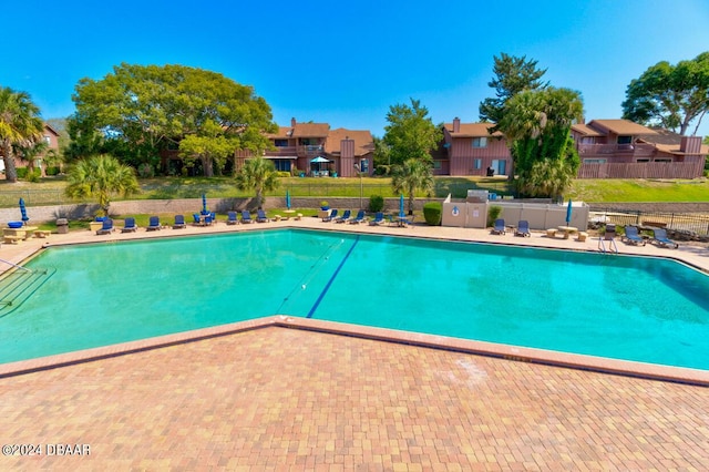 view of swimming pool featuring a patio