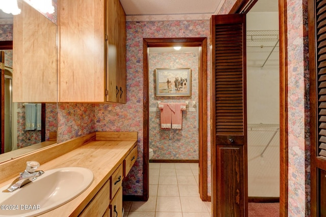 bathroom with vanity and tile patterned floors