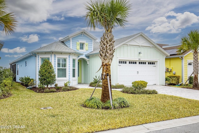 view of front of property with a garage and a front yard