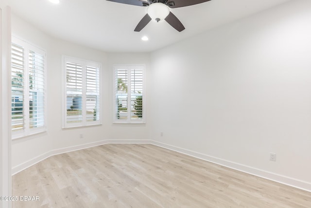 unfurnished room with ceiling fan and light hardwood / wood-style flooring