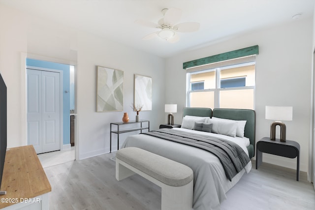 bedroom with ceiling fan and light wood-type flooring