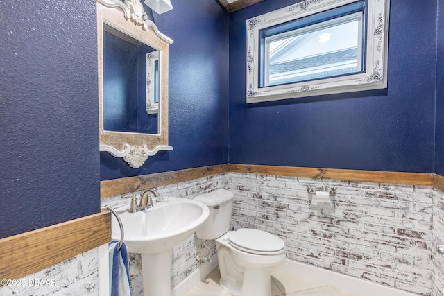 bathroom featuring sink and toilet