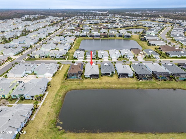 birds eye view of property featuring a water view