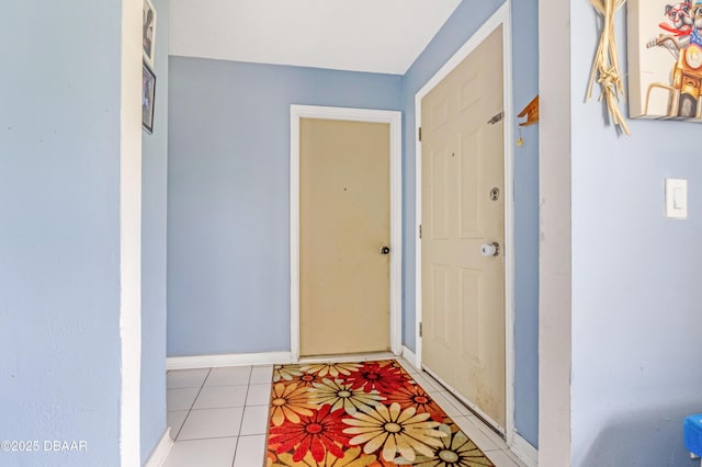 3618 Dame St, Port Orange, FL 32129 - entryway featuring light tile patterned flooring and baseboards