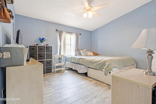 3618 Dame St, Port Orange, FL 32129 - bedroom featuring a textured ceiling, lofted ceiling, wood finished floors, and ceiling fan