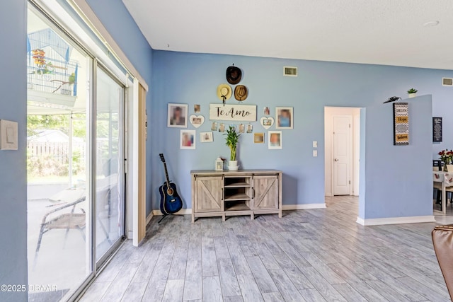 3618 Dame St, Port Orange, FL 32129 - foyer entrance featuring baseboards and light wood finished floors