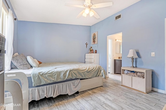 3618 Dame St, Port Orange, FL 32129 - bedroom with light wood-style floors, a ceiling fan, and ensuite bathroom