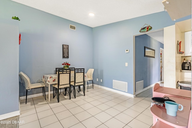 3618 Dame St, Port Orange, FL 32129 - dining area featuring baseboards and light tile patterned floors
