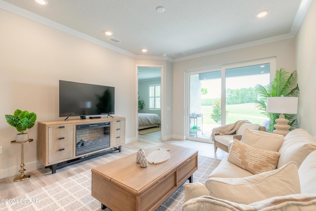 3066 Isles Way, New Smyrna Beach, FL 32168 - living area featuring light wood-style flooring, ornamental molding, and recessed lighting