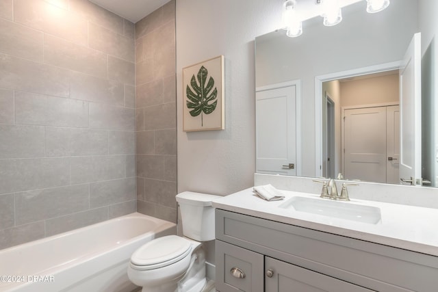 full bathroom featuring vanity, tiled shower / bath combo, and toilet