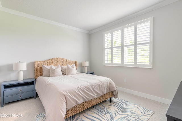 carpeted bedroom featuring ornamental molding