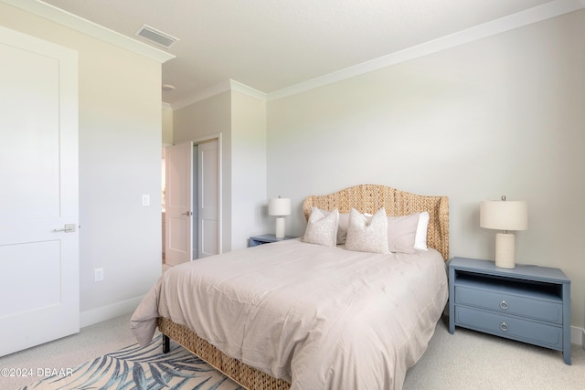 carpeted bedroom featuring crown molding