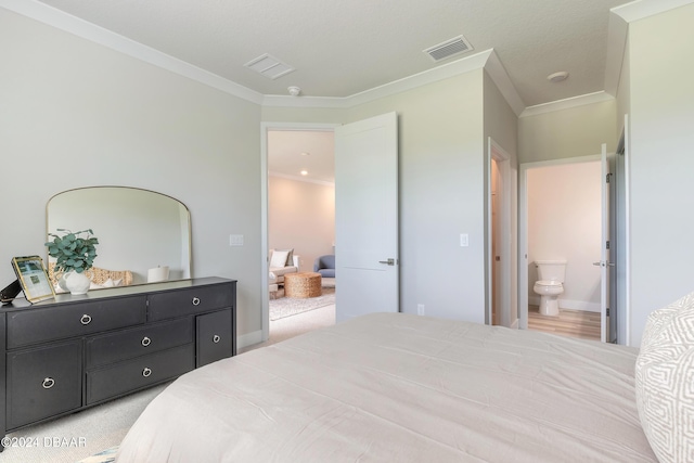 3066 Isles Way, New Smyrna Beach, FL 32168 - bedroom featuring ornamental molding, ensuite bathroom, and light carpet