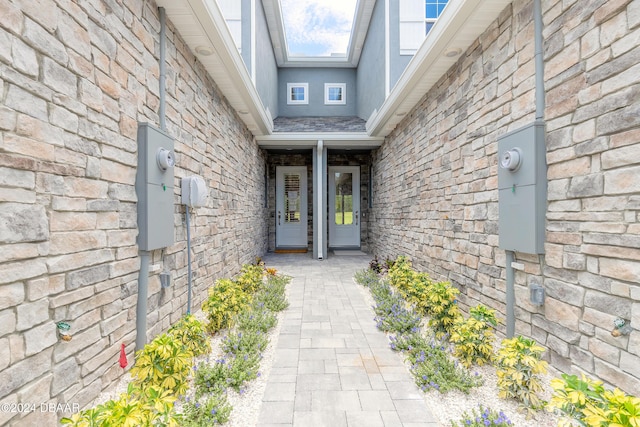 3066 Isles Way, New Smyrna Beach, FL 32168 - doorway to property with stone siding