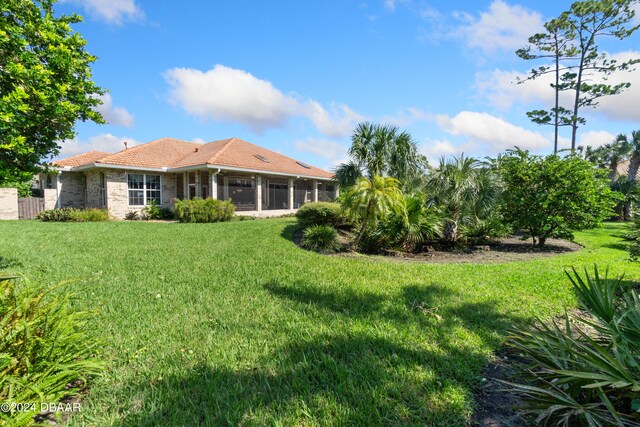 view of yard featuring a sunroom