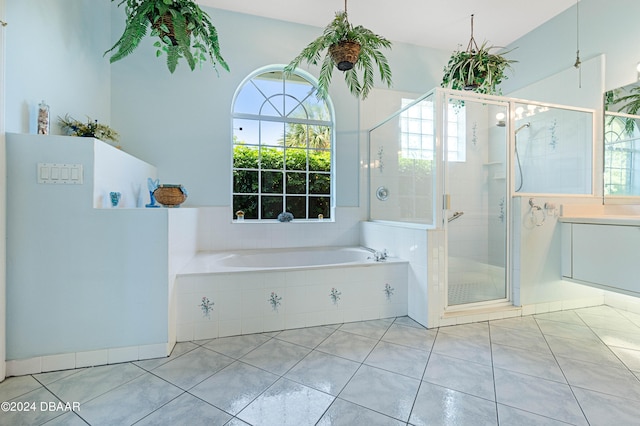 bathroom featuring tile patterned floors and plus walk in shower