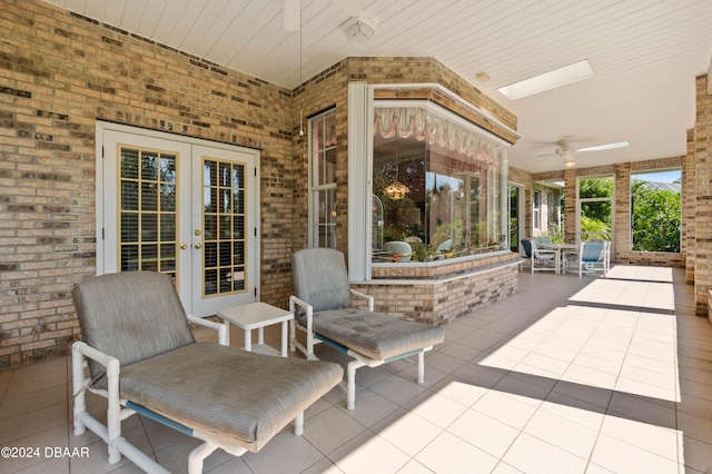 view of patio / terrace featuring ceiling fan and french doors