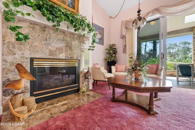 living room with carpet flooring and a premium fireplace