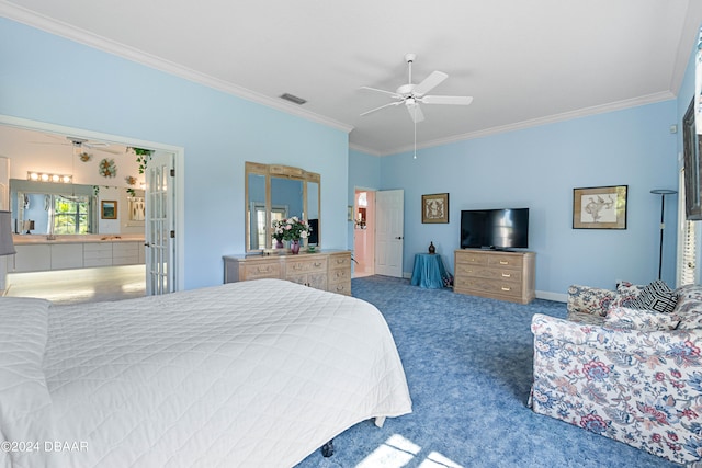 carpeted bedroom with ornamental molding, connected bathroom, and ceiling fan