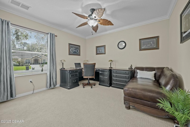 office area with light colored carpet, visible vents, ornamental molding, a ceiling fan, and baseboards